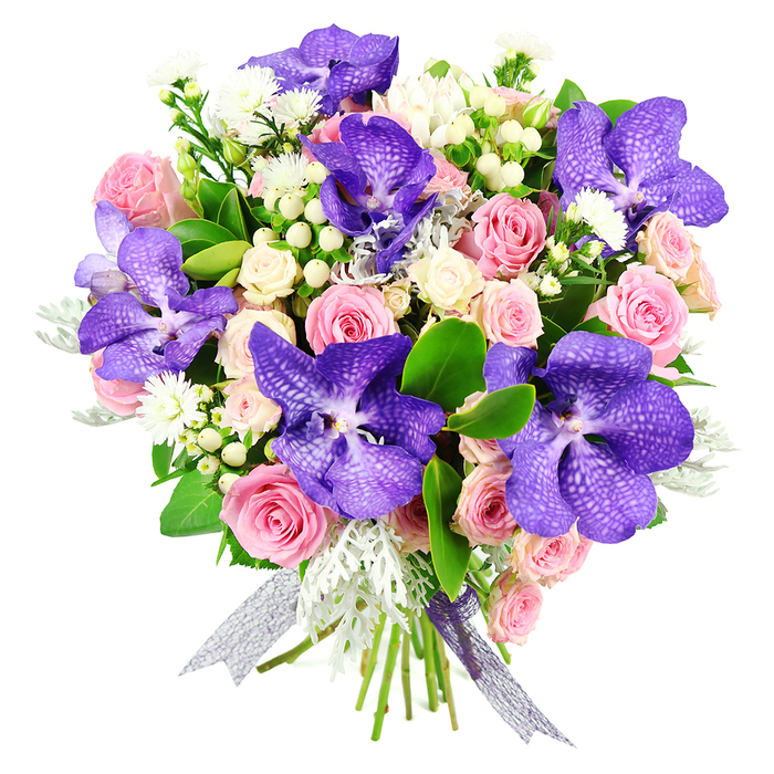 A sophisticated floral arrangement is showcased against a crisp white background, allowing every blossom and leaf to stand out in vivid detail. The eye is immediately drawn to the striking Vanda orchids, whose large, flat petals are drenched in rich shades of purple and deep blue, marked with a fine web of speckling and veining that gives them an almost celestial appearance. These bold, exotic flowers rise confidently from the bouquet, framed by layers of pastel pink roses at various stages of bloom, from tightly curled buds to fully opened rosettes with soft, velvety petals. Nestled among them are clusters of creamy white spray roses, each small head adding to the bouquet's fullness and romantic character. Between the main flowers, tiny white filler blooms-reminiscent of delicate asters or miniature daisies-and smooth, white hypericum berries lend subtle texture, catching the light in small, scattered highlights. The cooler tones of feathery, silvery-grey dusty miller foliage weave gracefully through the design, softening the palette and evoking the gentle haze of an early morning over the fields surrounding Epping. Dark, glossy green leaves curve around the outer edges, giving the bouquet structure and a lush, garden-grown feel. At the base, the stems are neatly tied with a sheer ribbon that shimmers in a harmonious blend of silver and purple, its trailing ends echoing the graceful lines of the orchids above. The overall impression is one of refined luxury and thoughtful design, perfectly suited to mark anniversaries, significant birthdays, or heartfelt thank-you gestures delivered across Epping and nearby areas, from Coopersale to Theydon Bois, by a florist who understands both modern style and classic romance.