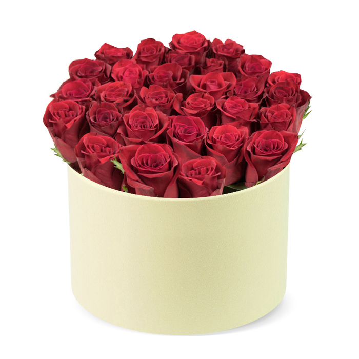 An impeccably curated, luxurious boxed bouquet of crimson roses, the kind that elevates a room as it arrives. There are roughly two dozen blooms, their velvety petals tightly furled, the deep crimson color absorbing the light with velvety glow. They are arranged to fill a round pale cream box, the matte surface providing a quiet, sophisticated backdrop for the flowers. Green foliage threads between the heads, offering a subtle, natural contrast that enhances depth and life. The dome of roses rises confidently above the rim, a visual statement of generosity and refined taste. The packaging's understated elegance-soft lines, smooth finish-speaks of premium gifting and careful handling.

Viewed from a slightly elevated three-quarter angle against a crisp white background, the composition emphasizes craftsmanship and balance. The composition invites you to imagine the soft rustle of petals, the faint scent of rose, and the gentle weight of the box in your hands. This elevated arrangement is ideal for anniversaries, romantic milestones, or special occasions when a celebration deserves something truly luxurious. It alludes to a tailored delivery service-timely, discreet, and reliable-perfect for events across Epping and the surrounding towns, where a single box can mark a moment with polished sophistication.