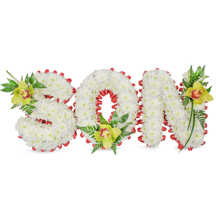 This composed sympathy piece spells SON in three-dimensional lettering made entirely from densely packed white chrysanthemums, their tiny petals forming a continuous, cloud-like skin over each letter. Set against a spare white background, the sculpted forms feel calm and resolved; a continuous band of vivid red ribbon is carefully folded along every perimeter, forming a scalloped, decorative edge that frames the white blooms and draws the eye inward-especially into the circular opening of the O where the ribbon's curve echoes the letter's shape. Each letter is elegantly accented with a lime-green Cymbidium orchid: the S bears an orchid at its upper left, showing a pale orange and reddish-brown throat; the base of the O is cradled by another orchid and a small accumulation of glossy leaves and fern fronds; and the N's upper right is lifted by the third orchid, elongated leaves cascading to create subtle vertical movement. The contrast between the chrysanthemums' velvety matte, the orchids' firm, waxy petals, and the feathery texture of the ferns gives the arrangement depth and tactility, while a serene, neutral light models the forms without drama. Purposefully crafted as a funeral or memorial tribute, this design communicates purity, love, and remembrance for a beloved son. As someone who arranges for ceremonies around Epping and neighbouring villages such as Loughton and Theydon Bois, I envisage this piece being chosen by families seeking a dignified, personal floral statement for services in the town or beneath the familiar trees of Epping Forest.
