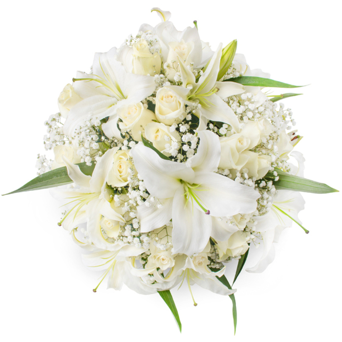 Seen directly from overhead on a pure white surface, this perfectly rounded bouquet presents an elegant study of white and cream textures: large white oriental lilies with open, trumpet-like petals and subtle green stamens sit amid clusters of creamy ivory roses, many held as neat buds or gently opening to reveal their layered centres. Between and around the stronger forms are delicate sprays of Baby's Breath (Gypsophila), their tiny white blossoms forming a soft, frothy cushion that fills negative spaces and lends a cloud-like lightness to the otherwise compact composition. A few fresh green leaves emerge at the perimeter, just enough to define the silhouette and introduce a natural contrast to the monochrome palette. The overhead viewpoint emphasises the bouquet's symmetry and dense assembly, highlighting the careful spacing that keeps the arrangement feeling both abundant and restrained.

Texturally, the lilies' broader, satiny petals contrast with the velvety, tightly furled rosebuds and the fine filamentary structure of the gypsophila, producing a tactile richness you can almost feel by sight. The scent would be quietly sweet and enveloping, a soft mix of lily perfume and rose warmth - appropriate for bridal work or as a dignified centrepiece at a reception in a local village hall near Bell Common or around St John's Road. Designed with a timeless sensibility, the bouquet reads as a celebration of purity and new beginnings while reflecting the steady hand of a florist who understands classical forms and the modest, enduring tastes of the Epping community.