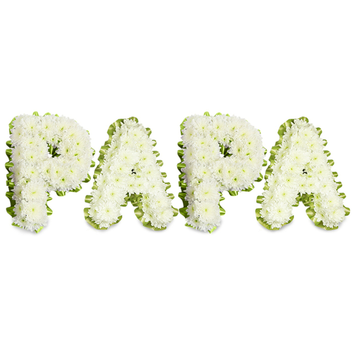 An elegantly understated sympathy arrangement spells out 'PAPA' in four substantial uppercase letters, each letter built from an abundant mass of tiny white flowers-most likely spray chrysanthemums or similar compact white blooms-arranged so closely together that the surface appears smooth, plush, and gently domed. The florist's technique is evident in the clean contours and even spacing: blooms are layered to form a continuous, velvety field within each character, while a slim, ruffled ribbon in pale green or a narrow border of fresh foliage wraps each letter, offering a crisp contrast that helps every curve and line read clearly against the white backdrop. The composition rests on a plain white ground that heightens the sense of calm and focus, allowing the white blossoms to convey purity and the green edging to suggest renewal. Up close, the arrangement reveals tactile detail-the faint, honeyed scent of chrysanthemum, the slight give of petals beneath the fingertips, and the soft play of light across petal ridges that produces subtle highlights and shadows. This bespoke lettering piece is custom-made for moments of farewell: funerals, memorial services, or a graveside tribute to a father or grandfather. Local families across Epping and the surrounding hamlets commission this style when they want a personal, readable message of love rendered in traditional colours of condolence. The overall effect is thoughtful and deeply respectful: a clean, handcrafted symbol of remembrance that balances tender intimacy with formal dignity and reflects the steady care of a local florist familiar with the rhythms of our community and its quieter goodbyes.