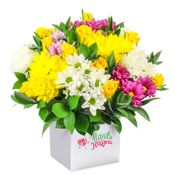 A lush, rounded bouquet overflows from a sleek white square box, set against a seamless white background that lets every colour sing. At the heart of the arrangement, generous clusters of golden yellow chrysanthemums and small, tightly furled yellow spray roses create a radiant core, their many petals layered like soft ruffles. Interwoven between them are cool white daisy-style blooms with fresh green centres and plump white chrysanthemums with a feathery texture, adding both brightness and a sense of airy lightness. The eye is then drawn to vivid fuchsia and magenta chrysanthemums scattered throughout, their rich tones shifting from deep raspberry to softer pink, giving the design a lively rhythm much like the changing colours across Epping's gardens in late spring. Thick, glossy dark green foliage surrounds and supports the flowers, its slightly curved leaves framing the blooms and echoing the greenery seen along the paths of Epping Forest. The contemporary white box acts as a minimalist pedestal, emphasising the dome of flowers above and suggesting an arrangement that would sit beautifully on a kitchen table in a cottage near Bell Common or on a reception desk along the High Road. Each flower appears carefully chosen and precisely positioned, reflecting a professional florist's eye for balance, texture, and value, making this design ideal for sending an affordable yet impressive message of congratulations, get-well wishes, or simple appreciation. The overall composition feels joyful and welcoming, as though it has been freshly prepared for same-day delivery to brighten an ordinary day in and around Epping.