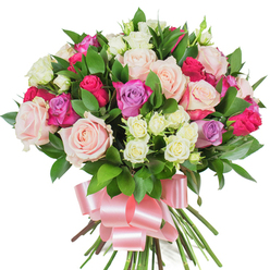 In this richly packed hand-tied bouquet, an experienced florist's eye shows in the careful placement of colour and texture against a bright white backdrop. The arrangement is built around large, fully opened roses in pale pastel pink and creamy ivory, their soft, layered petals creating a cloud-like centre. Interspersed are vivid fuchsia roses that bring warmth and joyous contrast, while a scattering of lavender-hued roses introduces a cool, poetic note. Small clusters of creamy-white spray roses nestle between the larger heads, providing delicate punctuation and tactile variety. Glossy, dark-green foliage - thought to be ruscus or salal - is threaded through the stems, its smooth leaves catching the light and framing each bloom with verdant depth. At the base, the generous stems are neatly bound and finished with a wide, satin ribbon in a gentle pink, tied into an elegant bow whose lustre complements the rose tones. The bouquet reads as celebratory and intimate at once, sending modest perfume of classic roses and the green freshness of cut leaves. As someone who designs bouquets for local deliveries around Epping Forest and Bell Common, I imagine this tied with care for Mother's Day, Valentine's, or to mark an anniversary; it travels well from our shop to nearby streets and makes a quietly sophisticated gift. Flowers Epping prepares arrangements like this frequently, emphasising freshness, balanced colour, and a presentation that feels both modern and tender against the uncluttered white background.