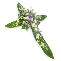 Presented on a clean white field and seen from a slight top-down angle, this floral cross is a carefully constructed tribute that combines structural greenery with tender, muted blooms. Large, gleaming green tropical leaves-arranged with an artisan's precision-form the defined arms and centre spine of the cross; their smooth, veined surfaces reflect a gentle light and create a strong, grounding silhouette. Concentrated where the arms meet, a generous cluster of soft white and ivory flowers unfolds: ruffled lisianthus offer layered, velvet-like petals and soft unopened buds, while compact white chrysanthemums or spray roses add small, luminous points across the design. Sprays of tiny lavender-hued, star-shaped flowers-likely limonium or petite asters-thread through the main body, adding delicate color contrast and a whisper of wistfulness. Slimer green fillers and delicate foliage are woven throughout to lift the composition and soften edges. The impression is one of calm dignity, a tribute appropriate for funeral services, memorials, or graveside ceremonies, with a subtle, green-tinged scent rather than heavy perfume. Crafted with the care of an Epping workshop familiar with morning deliveries to St John's and the surrounding lanes, this piece is the sort of sympathy cross we arrange at Flowers Epping for local services- simple, composed, and deeply respectful, intended to convey solace, faith, and quiet remembrance.