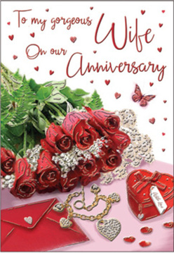 This anniversary card image unfolds like an intimate moment shared at a cosy table in Epping, with a small bouquet of crimson red roses arranged in the centre as though freshly cut by a careful florist. The roses are plump and layered, petals swirling inwards in a rich shade of scarlet that hints at long-lasting passion and devotion. Around them, sprigs of lush greenery weave gently, their leaves a bright contrast that brings the flowers to life, recalling the leafy paths of nearby Epping Forest. Set beside the blooms lies a simple, elegant envelope, its smooth surface suggesting a handwritten love note inside, the kind of message slipped across the table in a quiet restaurant off the High Street. A treasured piece of jewellery is placed close by, perhaps a fine chain or pendant, its subtle sparkle mirrored in a compact, heart-shaped box resting nearby, like a keepsake kept safe over many years of shared milestones. Scattered across the scene are tiny hearts and glinting decorative details, catching the soft, natural light that fills the composition with warmth. A graceful butterfly motif hovers near the roses, wings lightly open as if pausing on a summer evening near Stonards Hill. The lighting is gentle and even, bathing the arrangement in a calm glow that enhances the satiny sheen of the petals and the smooth curve of the box. Altogether, the design feels both romantic and personal, a still moment crafted to celebrate an anniversary with depth, tenderness, and quiet joy.