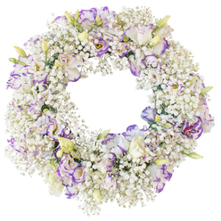 A large, round floral wreath is displayed on a plain white backdrop, its shape perfectly balanced and its flowers densely packed to create a sense of fullness and quiet luxury. The entire ring is wrapped in feathery sprays of white Baby's Breath, so abundant that they resemble a soft mist or a ring of gentle morning cloud. Rising from this delicate haze are clusters of Lisianthus, each bloom with softly ruffled petals that open out like miniature roses. Their petals are predominantly white, yet the edges and inner folds are traced with shades of lilac, lavender, and deeper violet, creating a cool, soothing contrast that draws the eye without breaking the wreath's calm mood. Some flowers are in full bloom, while others remain partially closed buds, tinged with pale green and creamy yellow at their tips, suggesting new life and continuity. The open centre of the wreath is clearly defined, giving the design a strong, traditional silhouette often chosen for farewells and acts of remembrance. With no additional foliage, the textures of the Baby's Breath and Lisianthus take centre stage, conveying tenderness and purity. The soft, neutral lighting and white background echo the quiet interiors of Epping's small chapels and funeral homes, where arrangements like this are laid beside photographs or candles. It feels like a thoughtful, hand-crafted tribute that could be delivered to a service near Epping Forest or to a family home along Bower Hill, bringing a gentle expression of sympathy, grace, and unspoken support.