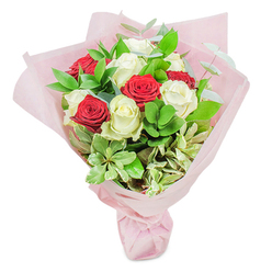 This exquisite bouquet from talented Epping florists pays homage to both modern romance and the natural tranquillity of the area. Centered within the arrangement are twenty pristine roses-ten a rich, emotive crimson, the other ten an immaculate creamy white-grouped in a balanced pattern that evokes the clean, crisp lines of Epping's historic architecture. The red roses pulse with vibrancy while the white blooms offer a serene, almost ethereal contrast. Between the petals, you'll find layers of deep green ruscus and supple eucalyptus, their textures evocative of fresh walks along Bell Common or the edges of Epping Forest. Subtle variegated foliage, brushed with cream and pale green, peeks out to lift the bouquet's mood and ensure visual interest from every vantage point. The entire floral embrace is swaddled in translucent, soft pink paper, a gentle shell that delicately captures the filtered window light, imbuing the scene with a feeling of promise and hope. The bouquet invites gentle inspection-each petal's fullness, each leaf's glossy sheen, brimming with tales of care and local expertise. Crafted to suit celebratory moments such as anniversaries or as a gesture of appreciation, this arrangement delivers a sophisticated blend of tenderness and passion, all delivered with that signature Epping touch. It's a bouquet that doesn't just decorate a room, but transforms it-infusing it with colour, fragrance, and the sentiment of locally sourced artistry.