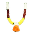 A handcrafted U-shaped ceremonial garland hangs against a crisp white backdrop, every curve and colour rendered with careful, traditional balance. From the short upright tips it begins with dense clusters of creamy white florets - soft, pillowy shapes that read like miniature chrysanthemums or carnations, their silky textures catching the light like fresh cream. Below these, narrow bands of deep reddish-brown introduce a warm, earthy counterpoint; their layered, slightly flattened petals suggest dried-leaf or terracotta tones that anchor the design. The arms sweep down into a broad, cheerful band of bright golden-yellow, composed of fluffy, pom-pom-like elements that unmistakably echo marigold (genda) blooms: dense, sunlit and celebratory. At the lowest centre a generous pendant of ruffled orange petals hangs as a focal jewel, its multi-layered form tumbling into vivid saffron hues and offering a strong point of visual gravity. Small, bright green accents thread between colour blocks, implying leafy joins and giving the composition breathing room. The piece is clearly artificial - durable fibres and fine stitching provide a substantial, reusable weight, ideal for doorway torans used in puja altars, Diwali door hangings, Ganesh Chaturthi celebrations or wedding entrances in Epping homes. Under neutral studio lighting the surfaces read matte to softly lustrous, and though the garland is synthetic, one can imagine a faint, comforting warm scent where fabric meets incense in a domestic shrine. As a local florist familiar with Epping Forest gatherings and High Street decorations, I see this as both invitation and blessing: traditional in palette and modern in longevity, intended to welcome guests with colour, rhythm and cultural care.