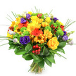 A vibrant hand-tied bouquet explodes with colour against a crisp white background, its rounded, compact shape suggesting the careful work of a skilled florist in Epping. At first glance, the dominant impression is sunshine: large yellow roses with velvety, spiralled centres and softly unfurling petals rest alongside generous yellow chrysanthemums and smaller daisy-like blooms, together creating a joyful, welcoming glow. These warm tones are intensified by vivid orange gerbera daisies, their signature broad petals and darker centres making bold statements across the bouquet, while smaller orange daisies tuck between them to enhance the sense of depth and richness. In contrast, deep purple lisianthus thread gracefully through the composition, their gently ruffled petals and partially opened buds adding a cool, sophisticated shadow that balances the brighter colours. Nestled among the blooms, lime-green button chrysanthemums appear as neat, spherical pom-poms, bringing a lively, zesty freshness that feels reminiscent of spring walks through Epping Forest. Scattered clusters of ruby-red hypericum berries catch the light with a glossy sheen, offering a slightly unexpected, festive texture perfect for birthdays, thank-you gifts, or cheerful get-well deliveries around Epping and nearby villages. Slender blades of ornamental grass arc upward from the centre, giving the arrangement a subtle, windswept movement, while a ring of broad, dark green leaves at the base forms a rich, leafy collar that supports and frames the colourful flowers. The stems are visibly gathered and tied at the bottom, reinforcing the impression of a freshly prepared bouquet, ready to bring a burst of happiness to a dining table, office desk, or cosy sitting room anywhere in Epping.