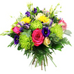 A richly coloured mixed bouquet fills the frame against a plain white background, its hand-tied, rounded form packed with blooms that almost seem to breathe with freshness. At the centre, a large hot pink or fuchsia rose opens in full, its velvety petals spiralling outward in lush layers that speak of romance and joy. Around it, clusters of lime green spider chrysanthemums stand out for their unusual, playful form: dozens of slender petals radiate in all directions, giving each flower a spiky, starburst effect that adds modern flair. Scattered throughout, bright yellow button-like chrysanthemums or similar small daisies bring a pop of sunshine, their compact dots of colour echoing the lively energy of Epping's busy High Street. Deep indigo and violet lisianthus blooms nestle between the brighter tones, their softly ruffled petals and velvety finish adding depth and a touch of luxury. Upright stems of creamy white or pale yellow freesia rise towards the top, each carrying several delicate, bell-shaped flowers along its length, hinting at a light, sweet fragrance. Here and there, small blush-pink spray roses peep out from the mix, offering gentle, romantic notes amid the bolder shades. The bouquet is generously framed with foliage: slender, arching fern fronds, sturdy broad leaves, and finer green stems that create a verdant, textural base and strengthen the round silhouette. The even white background throws every hue into sharp relief, making the pinks, yellows, greens, and purples appear particularly vivid. This composition feels joyful and celebratory, the kind of expertly arranged bouquet you might send to mark a milestone, congratulate a colleague in Epping, or bring a burst of colour to a table at home after a walk through Epping Forest.