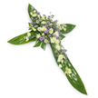 A solemn, elegant floral cross is shown against a pristine white backdrop, photographed from a gentle overhead angle that isolates every detail. The structural base is formed from broad, glossy tropical leaves-think Ti leaves-with deep green hues and visible veins that catch a soft, diffused light, their waxy surfaces folding to define the cross's arms and central spine. Nestled into this verdant foundation is a concentrated heart of blooms in a tranquil palette of creamy ivory, pure white, and powdery lavender. Creamy lisianthus with their ruffled, multi-layered petals and quiet buds provide the principal form and softness, while clusters of small, daisy-like white chrysanthemums or miniature spray roses add compact texture and bright highlights. Interspersed between them are delicate sprays of tiny star-shaped lavender or pale violet flowers-reminiscent of limonium or small asters-that give the arrangement air and a whisper of contrast, lifting the eye away from the dense centre. Finer green fillers peek through the floral clusters, their thin stems and feathery leaves softening the composition and adding natural depth. The overall scent would be faintly green and fresh rather than perfumed, an appropriate calm for funerals, memorial services or church tributes. Light skims the leaves and petals evenly, creating a serene radiance that reads as dignity and hope. As a local remembrance piece, it evokes quiet mornings by Epping Forest and the respectful hush of church services on the High Street-designed to bring comfort and graceful beauty to moments of mourning without overwhelming them.