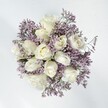 Serene elegance comes alive in this hand-gathered bouquet, a harmonious fusion of creamy white roses and delicate sprays of lavender statice that evoke the peace of a dawn stroll through Epping's open spaces. The roses are plush and velvety, unfolding their soft hearts in a show of quiet beauty, each one lovingly placed to invite touch and admiration. Interspersed, the lavender statice arcs and branches, its fine, papery florets offering a gentle contrast that hints at the wild charm of fields along High Street. The overall impression is gently enchanting: the creamy, chalk-soft blooms balanced by the unique texture and muted violet haze of the statice. Bathed in soft daylight, this bouquet is luminous and hopeful, perfectly suited for moments of grace-be they weddings, anniversaries, or simple gestures of heartfelt care. There's a calming, romantic ambience, as though time has paused to admire this delicate artistry. A subtle, powdery fragrance floats nearby, reminiscent of spring mornings and peaceful homes across Epping. The craftsmanship and sincere intent behind each element reflect the thoughtful hands of a florist dedicated to bringing comfort and joy to the community.