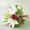This visually striking hand-tied bouquet, as if freshly prepared by a beloved local florist on Epping's High Street, is displayed against a muted, softly textured background that enhances each vibrant detail. Pristine, trumpet-shaped white lilies-some wide open, others still in their elongated lime-green buds-impart a sense of purity and anticipation. These lilies, graceful and commanding, are complemented at the centre by a single, tightly furled deep red rose, its velvety spiraling petals radiating timeless romance and sophistication. Interspersed among the main blooms, clusters of green spherical flowers-likely dianthus or green trick chrysanthemums-lend a plush, moss-like texture mimicking the peaceful meadows near Epping Forest. Airy sprigs of white baby's breath and clouds of fine, feathery foliage fill in the composition, offering softness and subtle movement, reminiscent of a gentle spring breeze across the local parklands. Glossy red hypericum berries punctuate the arrangement, their gleaming finish adding pops of exciting colour. All stems are neatly tied with a lustrous red satin ribbon, bringing unity and a celebratory accent that suits a range of occasions, from classic weddings to heartfelt anniversaries. The bouquet's expert blending of traditional floral favourites and modern textural accents make it a distinguished choice for commemorating special moments throughout Epping, embodying love, joy, and enduring artistry.