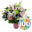 Against a bright white studio background, a jubilant centenary bouquet and balloon pairing is showcased as though ready for same-day delivery to a landmark 100th celebration in Epping. The arrangement, set in a sleek cylindrical vase finished in matte blush pink with subtle vertical ribbing, overflows with carefully chosen blooms that create a full, rounded silhouette. At the heart, several pale pink Oriental lilies open into dramatic star-shaped flowers, their petals gently curling back to reveal long stamens, while a few buds remain closed, promising future blossoms and a soft, lingering fragrance. Around the lilies, a mix of soft pink roses and deeper mauve, dusty rose roses are nestled close together, each bloom layered with velvety petals that suggest tenderness and enduring love. Rich purple lisianthus flowers weave between the roses, their silky, slightly ruffled petals adding a luxurious depth of colour. Delicate sprays of lavender asters, each tiny flower accented with a yellow centre, scatter light through the design, giving it a fresh, meadow-inspired feel like a stroll near the open spaces around Epping. Bright lime green button chrysanthemums pop from the bouquet, their rounded, textured heads providing lively contrast and a playful modern edge. Wisps of white baby's breath cloud softly through the entire arrangement, seamlessly linking the colours while various dark and mid-green leaves frame and support the flowers. On the lower right side, partially overlapping the vase, a glossy round foil balloon gleams with a joyful, multi-coloured confetti pattern in red, orange, yellow, green, blue, and purple. In its centre, large white numerals 100 stand proudly with a subtle three-dimensional effect, leaving no doubt that this is a tribute to a once-in-a-lifetime milestone. The composition exudes happiness, admiration, and the quiet awe of reaching a full century of memories.