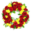 The photograph features a generously proportioned circular wreath, displayed front-on against a crisp white background so that every colour and texture stands out. The wreath itself is a solid band of flowers with a hollow centre, composed mainly of deep red roses intertwined with bright yellow chrysanthemums, suggesting a classic funeral or memorial tribute. The roses are fully open, their velvety petals arranged in detailed spirals that pass from a tight central bud to looser outer layers, with tones shifting subtly from clear crimson to a darker, almost wine-like red. Between these roses, clusters of small, rounded yellow chrysanthemums-each formed from countless slender petals-provide a light, airy counterpoint, their sunny hue bringing a gentle optimism to the design. Around and among the blooms, a rich layer of foliage helps define the circular shape: glossy, rounded green leaves sit alongside more slender stems with a soft, silvery-green cast, likely eucalyptus, giving depth and a slightly wild, garden-inspired feel. The flowers and greenery are placed very tightly, creating a smooth, continuous surface that looks carefully made and thoughtfully balanced. This is the sort of wreath that might be chosen by families in Epping for a farewell at a local church, cemetery, or crematorium, offering a blend of solemn red tones and comforting yellow notes. The bright, even lighting and plain backdrop highlight the freshness of the petals and leaves, making the wreath appear almost three-dimensional. The overall mood is one of respect, warmth, and enduring affection, ideal for a final tribute or celebration of life ceremony.