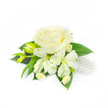 Set against a pristine white background, this compact boutonniere or corsage reads as quiet, refined elegance: at its heart a large, creamy white rose whose layered petals fold inward like velvet, catching soft highlights and casting gentle shadows that reveal the bloom's depth. Directly beneath and to either side of the rose are several slender freesia blossoms, their tapered, trumpet-like petals opened in pale ivory and a few elongated yellow-green freesia buds waiting to unfurl, lending a sense of fresh anticipation. Narrow, deep green leaves fan out beneath the flowers, glossy and cool to the touch, their linear shape giving the piece structure and a lively contrast to the soft roundness of the rose. Tucked discreetly on the right is a small cluster of lustrous white pearls, their nacreous sheen echoing classic bridal jewellery and adding a whisper of sparkle without overpowering the florals. Tiny, daisy-like fillers with pale yellow centres are woven gently among the stems, adding delicate texture and a hint of countryside charm. The overall composition is restrained and perfectly balanced, suggesting it would sit comfortably on a groom's lapel or a mother-of-the-bride's wrist on a spring morning. The scent is implied - cool, green and faintly sweet - like a stroll through Epping Forest at first light, where dew softens every petal. A local florist would note the craftsmanship: wired and taped with care so the piece maintains its shape during travel from the shop on Epping High Street to a nearby venue, arriving ready to complement formal attire with timeless simplicity and freshness.