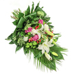 This lush sympathy spray, carefully handcrafted in Epping by dedicated florists, cascades diagonally in a display of grace and heartfelt expression. Creamy, trumpet-shaped white lilies take centre stage, their petals unfurling gently to reveal sunlit stamens, evoking peace and cherished memories. Warm fuchsia and pink roses bloom among the lilies, radiating affection and the enduring bonds of love. Between these, frills of white carnations and delicate sprays of similar pale blossoms offer fullness and texture, softening the arrangement's lines. Unique pops of vibrant green come from round, moss-like santini chrysanthemums, their modern texture gently contrasting with the traditional flowers. Scattered throughout are glowing red hypericum berries, each adding a natural, cheerful accent. The abundance of fresh, local greenery-bands of glossy aspidistra, airy feathery sprigs, and long palm fronds cascading downward-creates a rich, green backdrop reflecting the verdant spaces around Epping. The interplay of shadow and soft daylight highlights the bouquet's elegant contours, inviting moments of reflection and comfort. Especially suitable for sympathies and farewells, this spray embodies local care and artistry, bringing solace to families while honouring lives with dignity and gentle beauty.