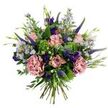 This hand-tied bouquet reads like a breath of early morning in Epping Forest, soft and quietly jubilant. At its centre several pale, antique-pink roses sit in various stages of bloom - some tight, blushing buds and others beginning to unfurl, their petal edges touched with a slightly deeper rose tone. Two fuller, dusty-rose carnations bring ruffled volume and a velvet texture that contrasts gently with the roses' smooth curves. Thin spires of deep indigo veronica thrust upward through the composition, giving vertical rhythm and a dramatic blue-violet counterpoint to the pastels. Scattered throughout are clusters of tiny, lavender-blue aster-like blooms with pinpoint yellow centres, their delicate star shapes lending an airy, meadow-like quality. Deeper purple lisianthus (eustoma) blooms and buds peek between petals, adding jewel-toned accents and a soft, rounded silhouette. The bouquet is grounded by silvery-green eucalyptus leaves whose muted sheen and rounded outlines calm the palette, while bright lime-green textural filler - resembling Santini chrysanthemum clusters or similar bushy foliage - brings a lively, fresh undercurrent. Slender green leaves and emerging buds weave between the flowers, enhancing the natural, hand-gathered look; the stems are visible and gathered at the base, confirming a classic hand-tied finish. The lighting in the photograph is gentle and natural, lifting the pastel tones and emphasizing subtle textures. This arrangement suggests understated celebration - a birthday, a thoughtful thank-you, or simply a way to bring the quiet beauty of an English garden into a home on Epping High Street or near the tube station.