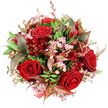 This image shows a sumptuous, round bouquet photographed from above on a spotless white background, every shade of red, pink, and green standing out with clarity, as though freshly arranged in an Epping florist's workshop. Dominating the arrangement are several deep crimson roses, fully open and velvety, their spiral centres drawing the eye inward with a sense of intense, classical romance. Around and between them, airy sprays of pale pink waxflowers appear, their tiny star-shaped blossoms and lemon-tinted centres adding a fine, almost frothy texture that lightens the composition. A generous halo of lush green foliage supports the blooms, with leaves of varying shapes and textures-from broad, glossy greens to more slender, slightly ruffled foliage-creating a sense of movement and fullness. Threaded throughout, rich burgundy and bronzed leaves introduce warmth and complexity, their reddish-brown veins recalling the earthy tones of nearby countryside paths and lending the bouquet a sophisticated, slightly autumnal feel. Nestled among the roses, smaller dark red flowers, likely alstroemeria or similar bell-shaped blooms, deepen the crimson palette, adding layers of colour that seem to recede into shadow. The bouquet is formed into a rounded dome that looks generous and abundant, every stem placed with intention. At the bottom edge, a red-and-white patterned tag or ribbon peeks into view, suggesting a finished gift, perhaps destined for a romantic dinner in Epping or a special anniversary surprise. The overall mood is luxurious and passionate, a design that expresses love, gratitude, and celebration in one rich, textured arrangement.