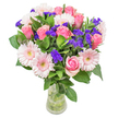 This bouquet strikes a gentle, poetic chord, blending soft blush pink roses and dainty pale gerbera daisies amid rich green foliage-a combination echoing the tranquil beauty of Epping's open spaces. Each rose's silken petals unfurl slowly, coloured by the warmth of afternoon sunlight filtering over the High Road, speaking quietly of new beginnings or tender appreciation. Scattered among the romantic hues, vivid violet statice introduces a playful contrast-its papery blooms and hint of wild fragrance reminiscent of the untamed hedgerows near Stonards Hill. The arrangement stays airy yet full, a spontaneous gathering of colour and life that feels as if plucked from a sunlit meadow on Epping's edge. Thoughtfully crafted for moments of celebration or gentle support-be it birthdays, congratulations, or words unspoken-every blossom is chosen with care, reflecting the heartfelt artistry and community connection fostered by local florists in Epping.